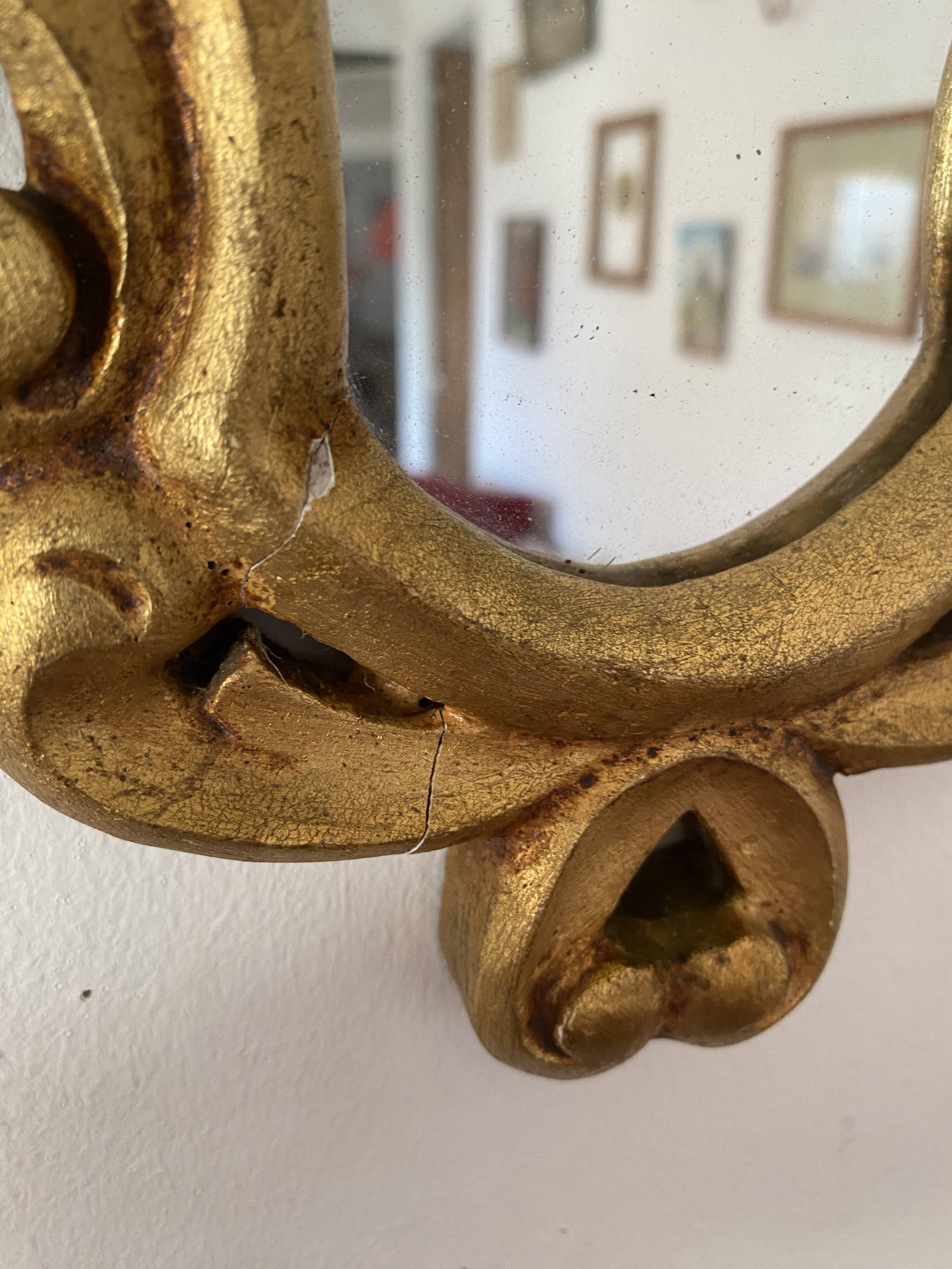 Golden mirror in baroque style.