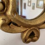 Golden mirror in baroque style.