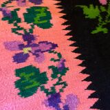 Oltenian floral rug handwoven in wool, purple flowers on black and pink background