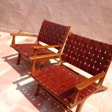 PAIR OF TEAK AND LEATHER ARMCHAIRS