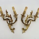 Vintage pair of double wall sconces in bronze from the 1960s.