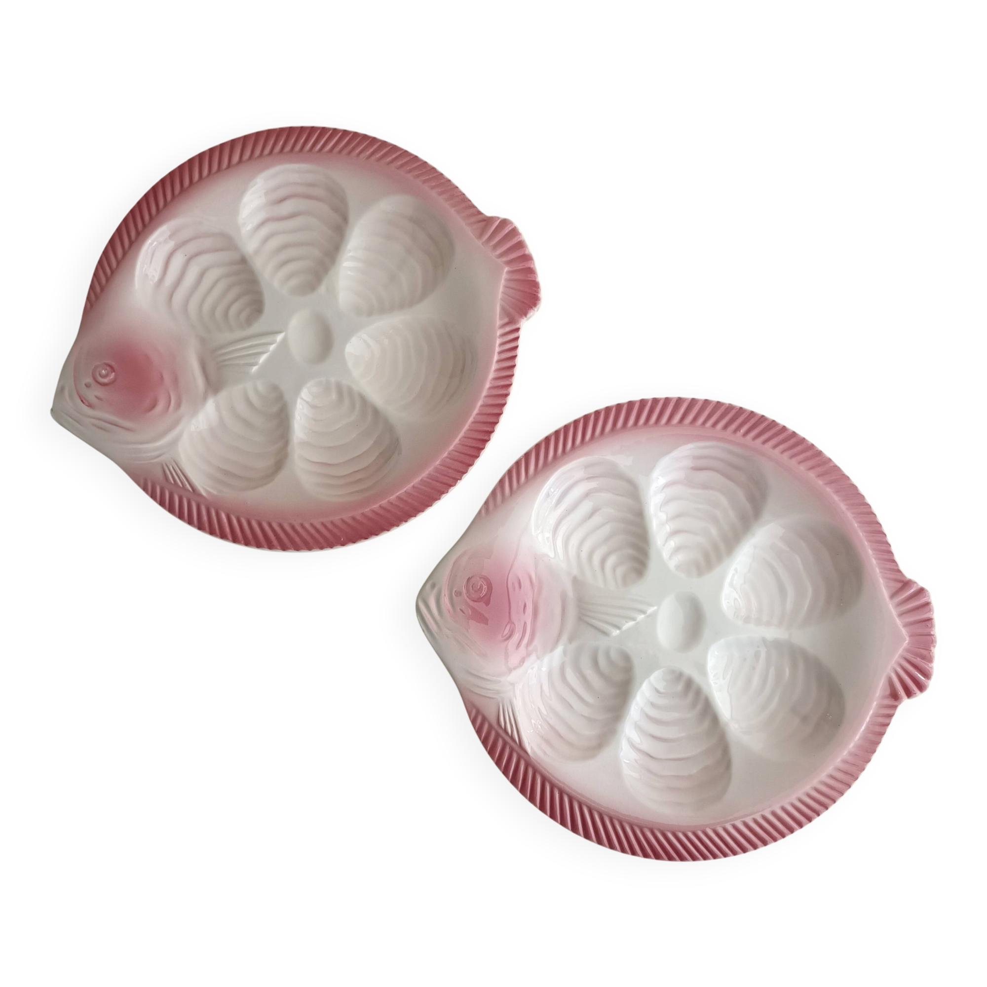Vintage oyster plates in the shape of a sole.