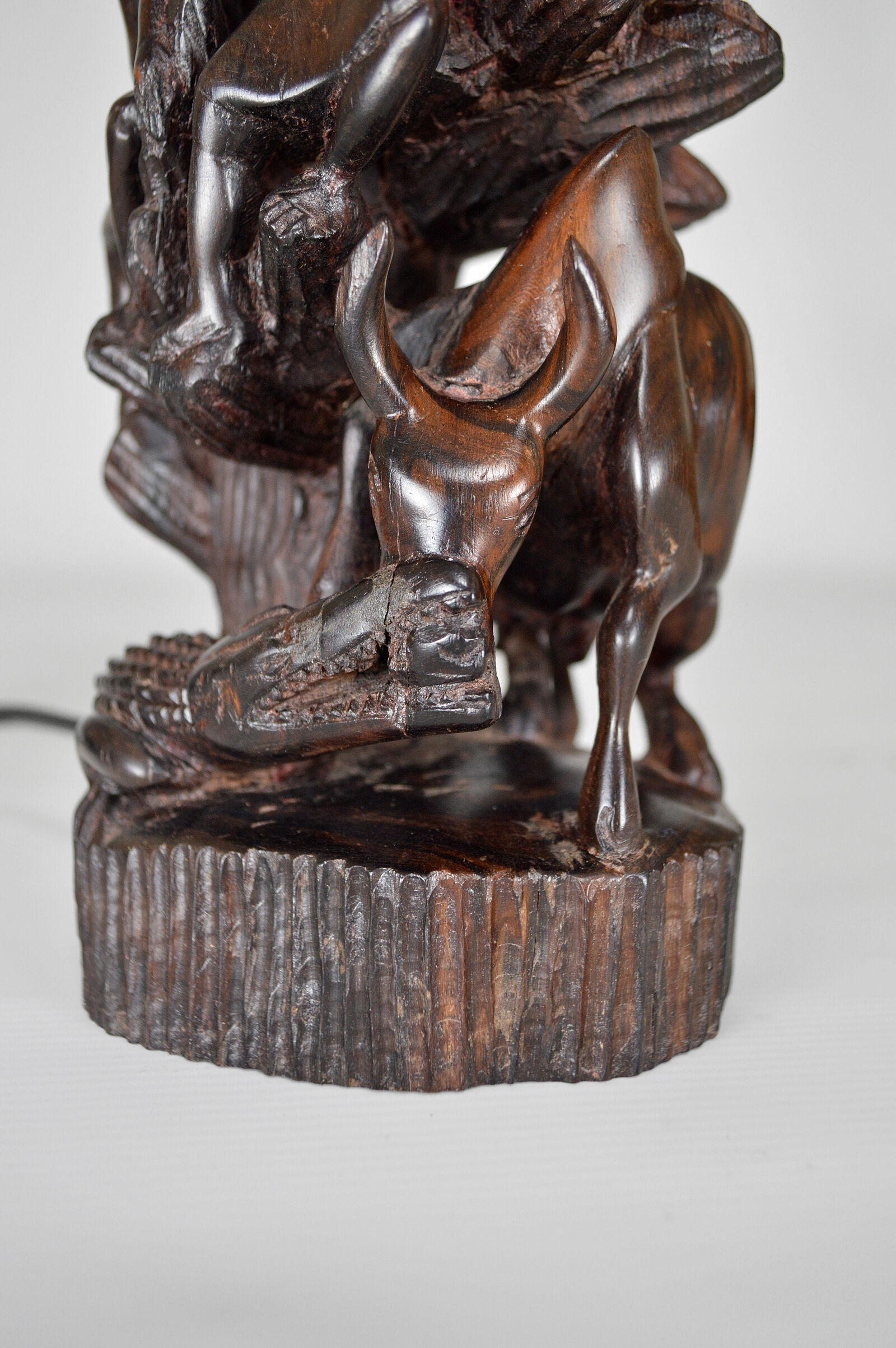 African carved ebony lamp, "Hunters, buffalo and crocodile"