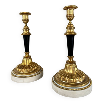 Pair of gilded and patinated bronze candlesticks