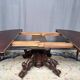 Hunting style dining table with figures of four different animals.