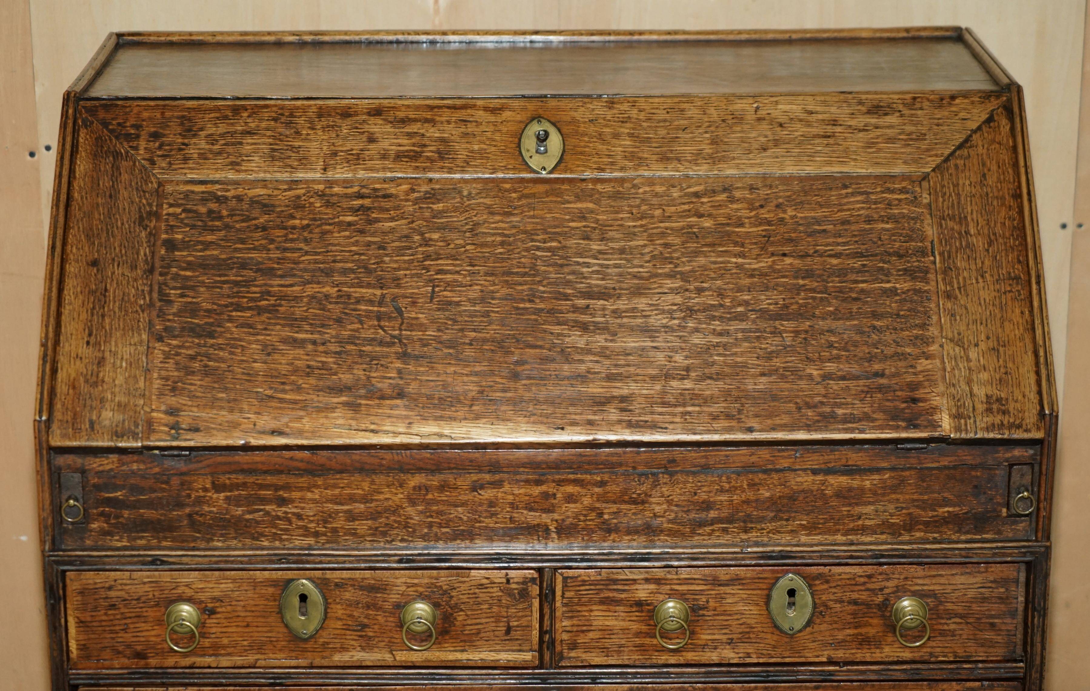 Ancient Georgian writing desk circa 1760 with a leather top.