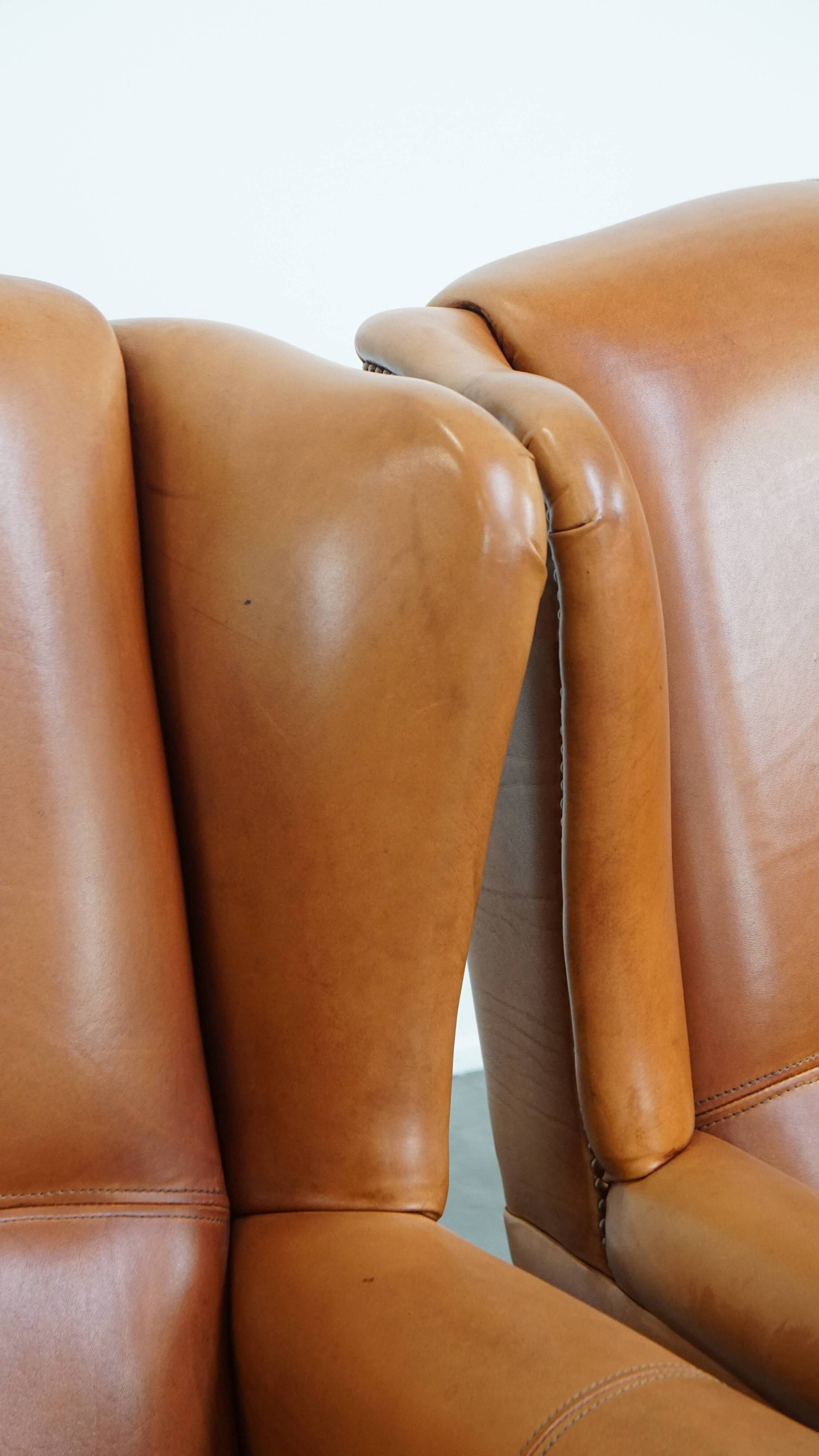 Set of 2 leather wingback chairs