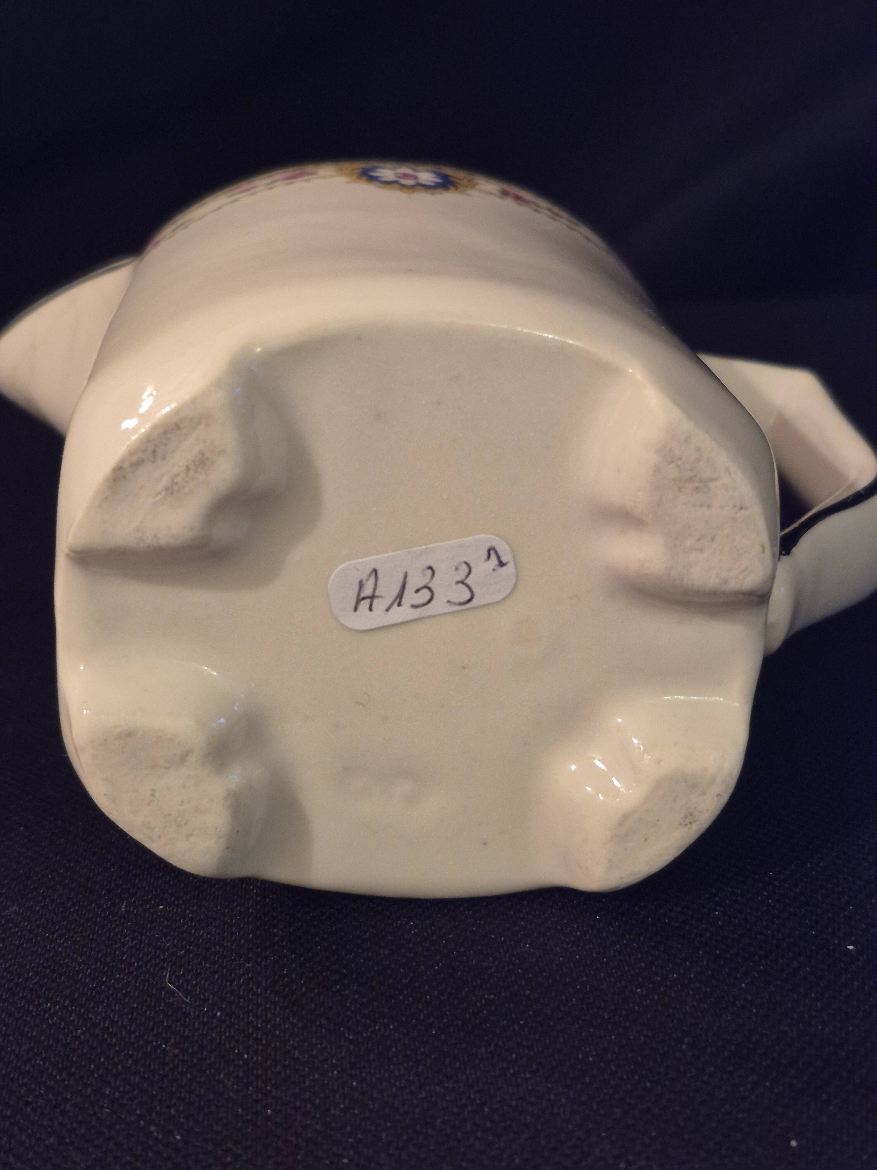 Old covered jug, vintage, geometric frieze and flowers with a border.