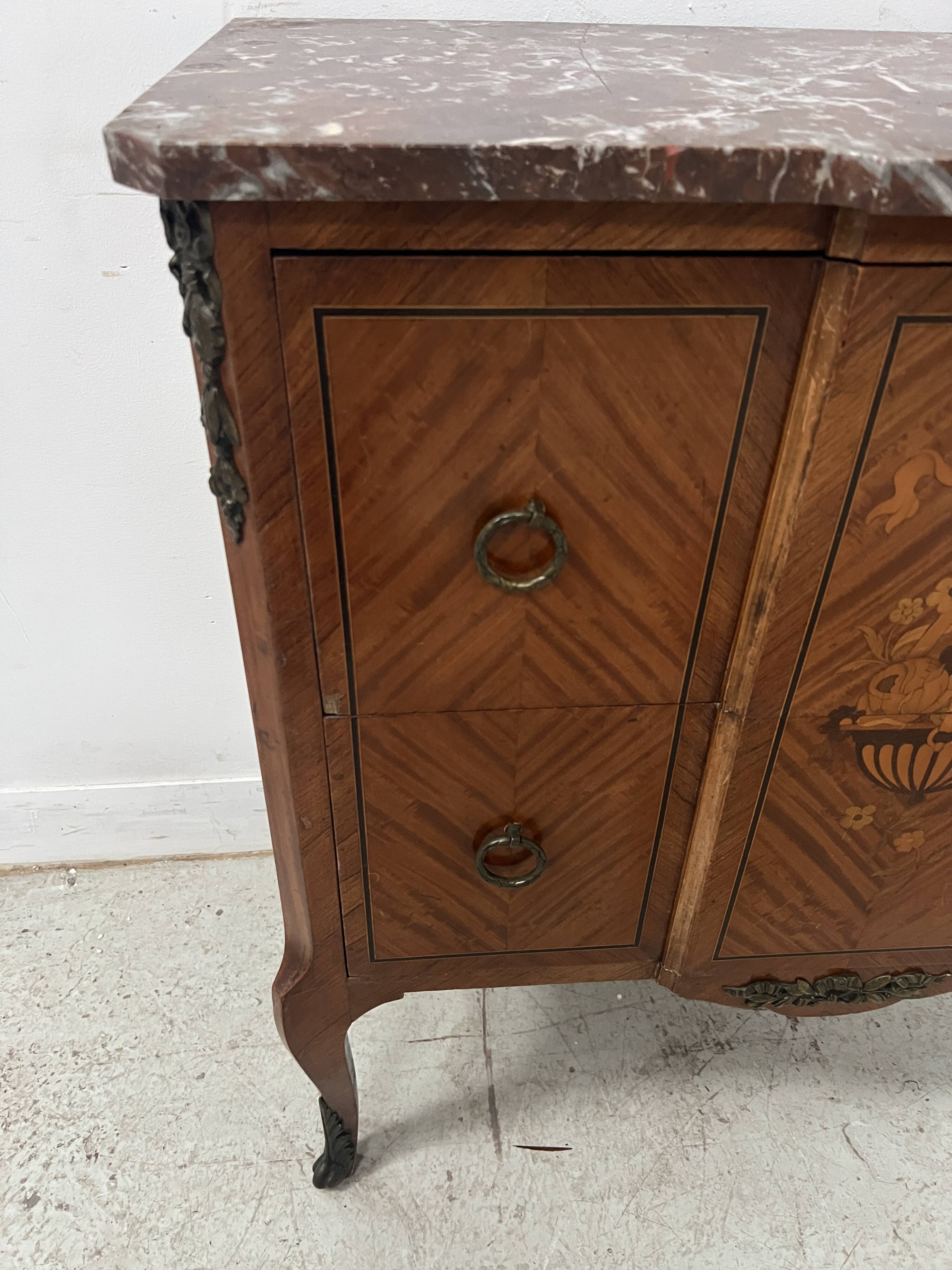 Transitional style commode with a protruding front, in marquetry wood, 20th century.