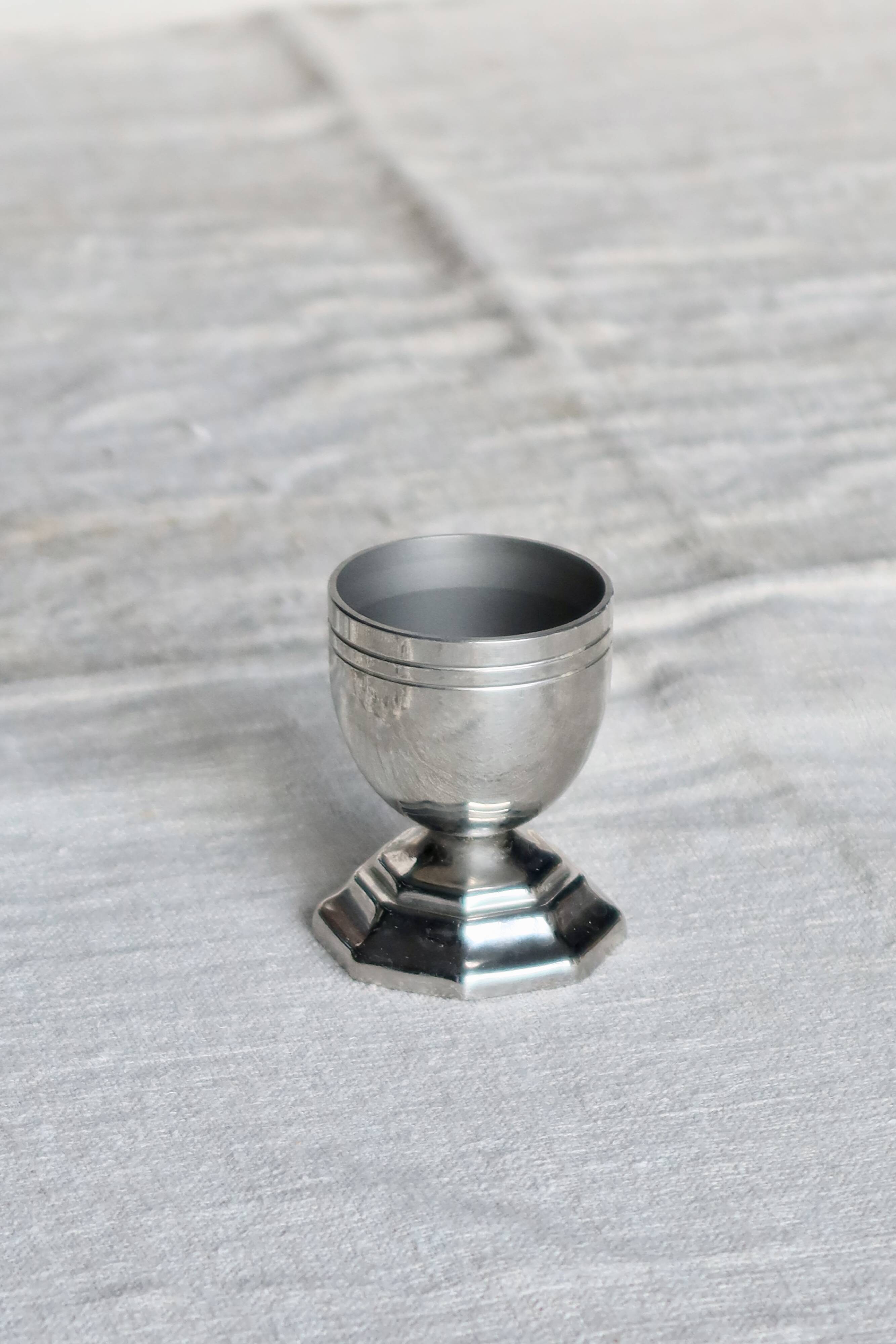 Vintage silver-plated egg cup with an octagonal base.