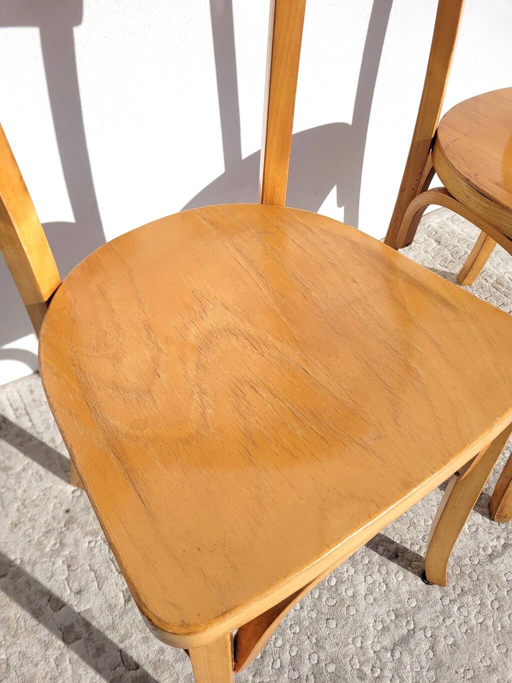 Pair of vintage bistro chairs in golden oak.