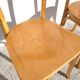 Pair of vintage bistro chairs in golden oak.