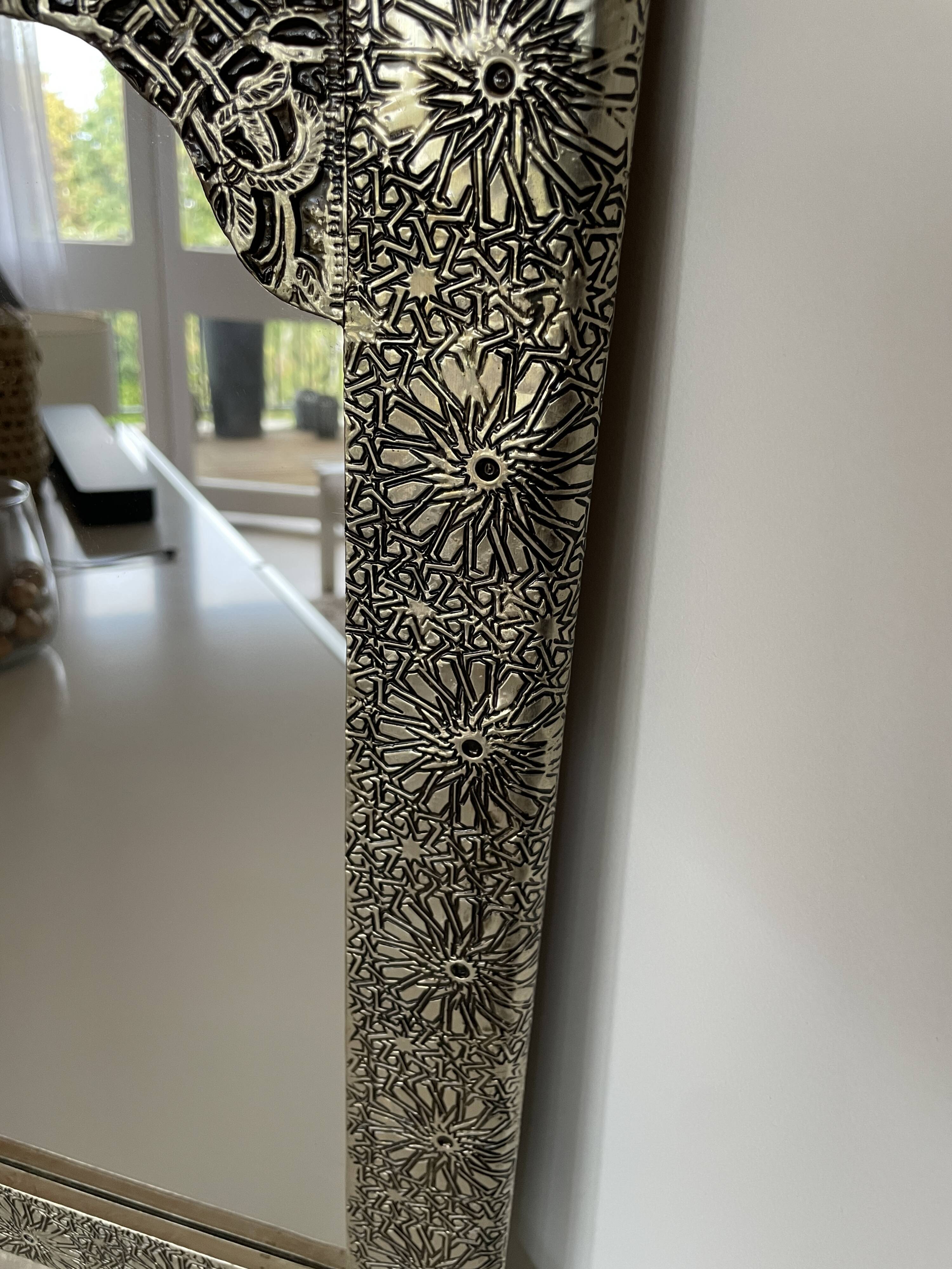 Silver oriental mirror