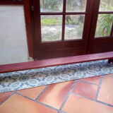 Low bench rests feet in patinated wood