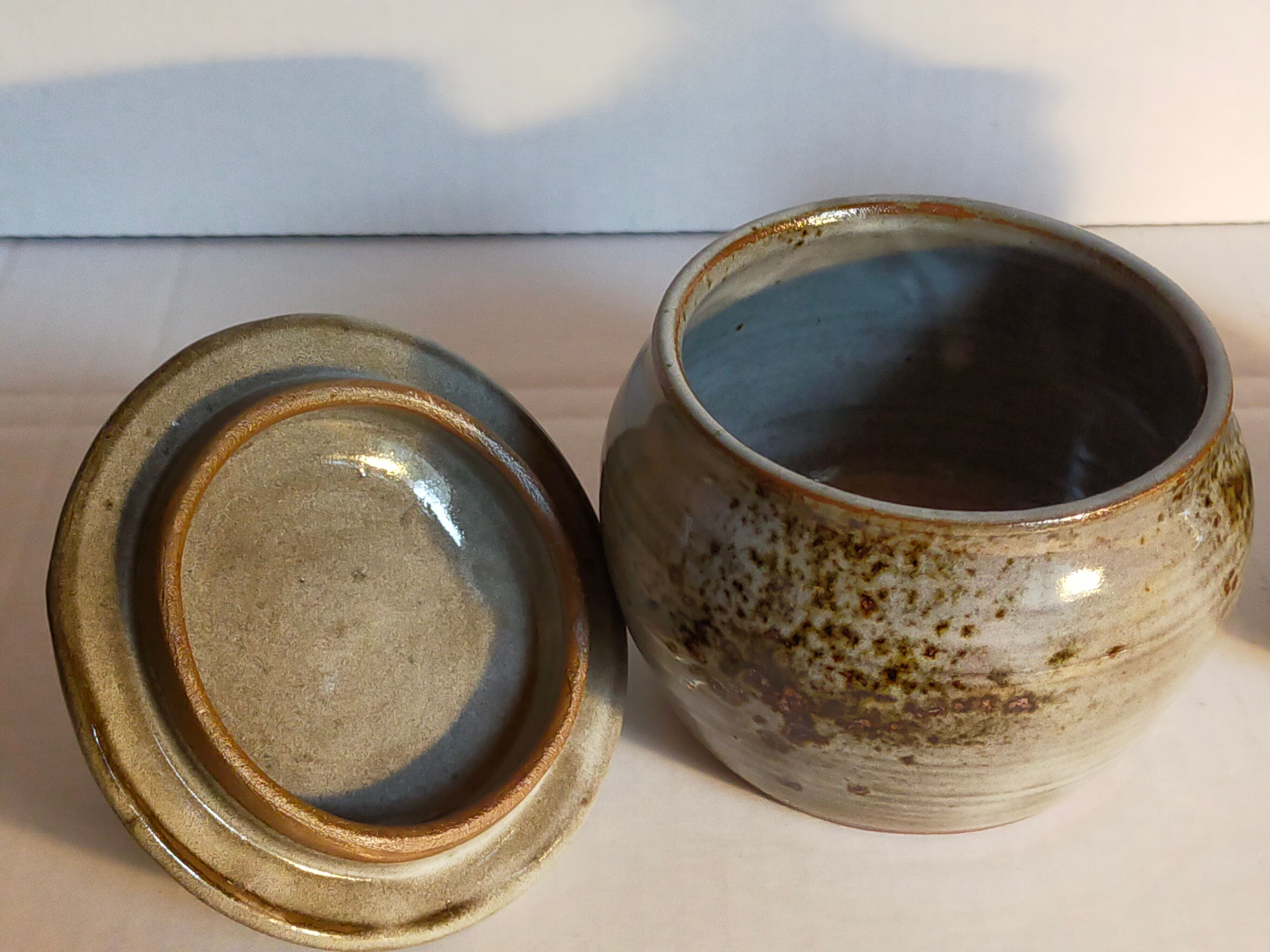 Duo of potter's pots covered in vintage glazed stoneware