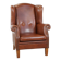 Cognac-colored leather wingback chair in English style