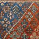 Vintage Turkish rug in brick red and indigo with floral design, 276 × 389 cm