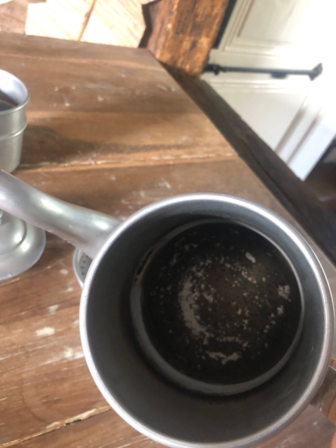 Old aluminum coffee maker, woven wicker handle