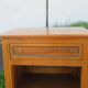 Pair of walnut bedside tables in Louis XVI style with brass inlay.