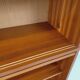 Vintage wooden bookshelf in teak style from the 1960s.