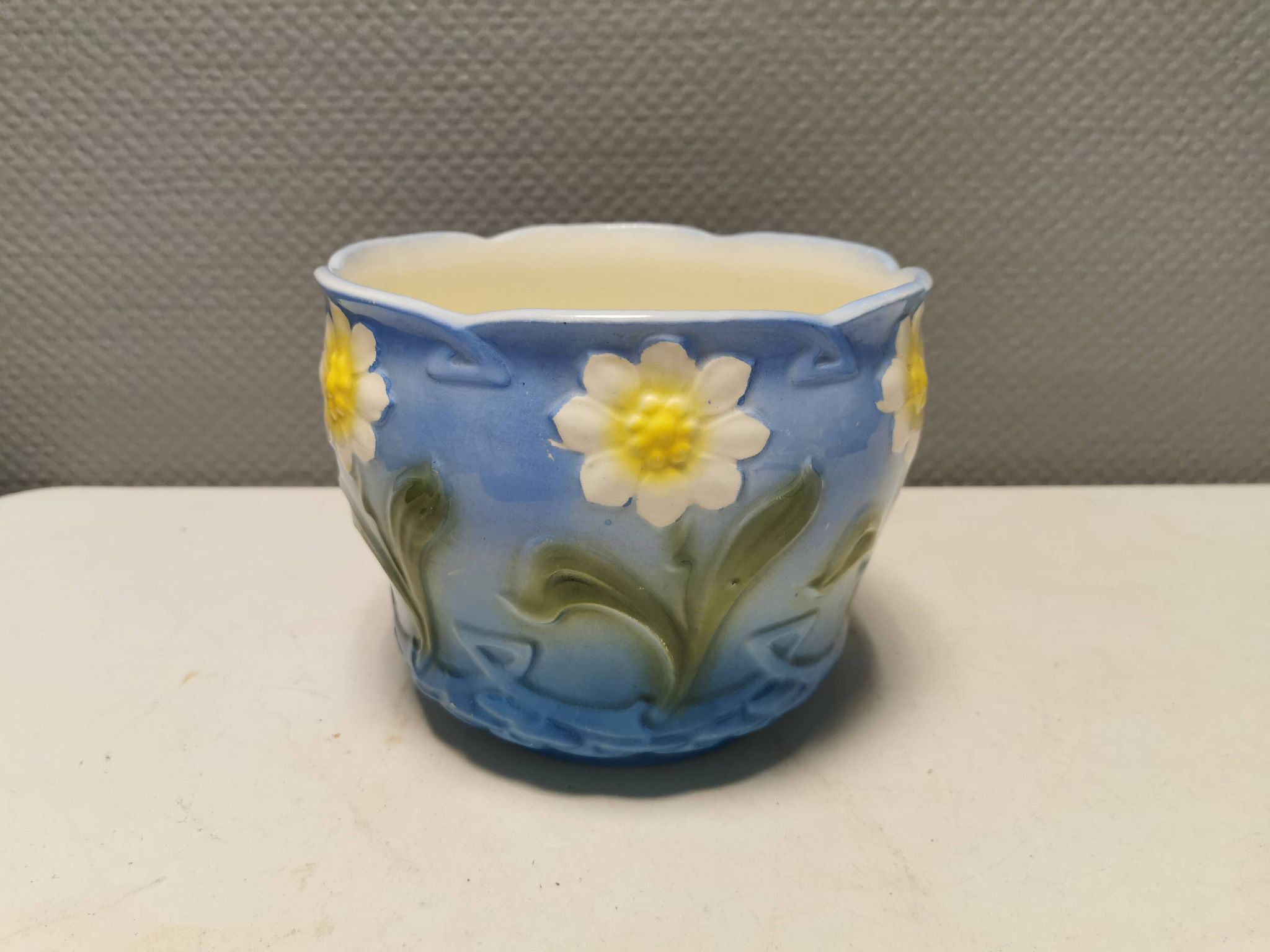 Very beautiful flower pot in soft blue and white color with floral motifs.
