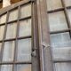 Two pairs of solid oak doors with small panes.