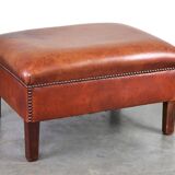 Leather ottoman in classic English style finished with decorative nails