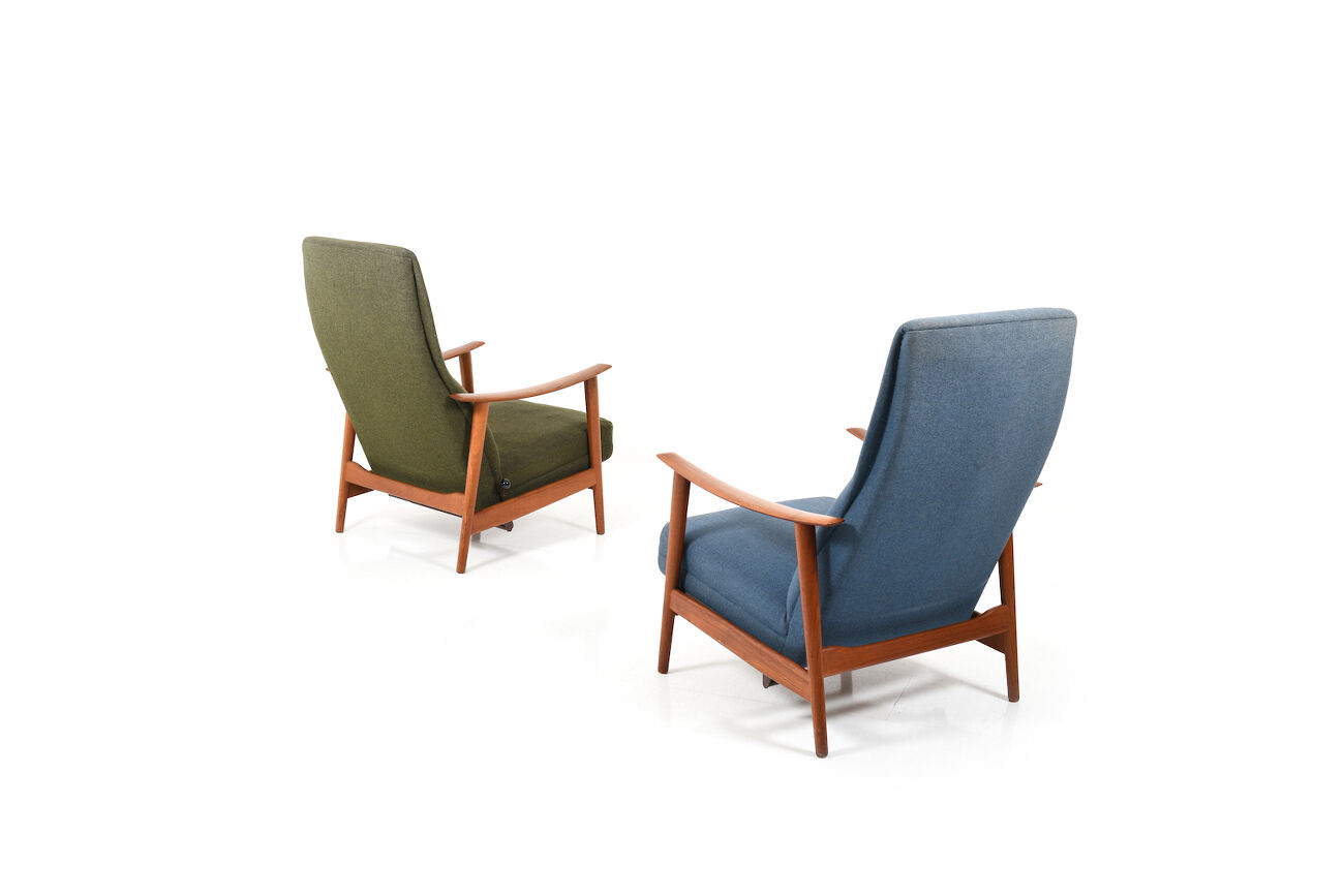 Pair of mid century Danish reclining lounge chairs in teak