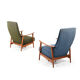 Pair of mid century Danish reclining lounge chairs in teak
