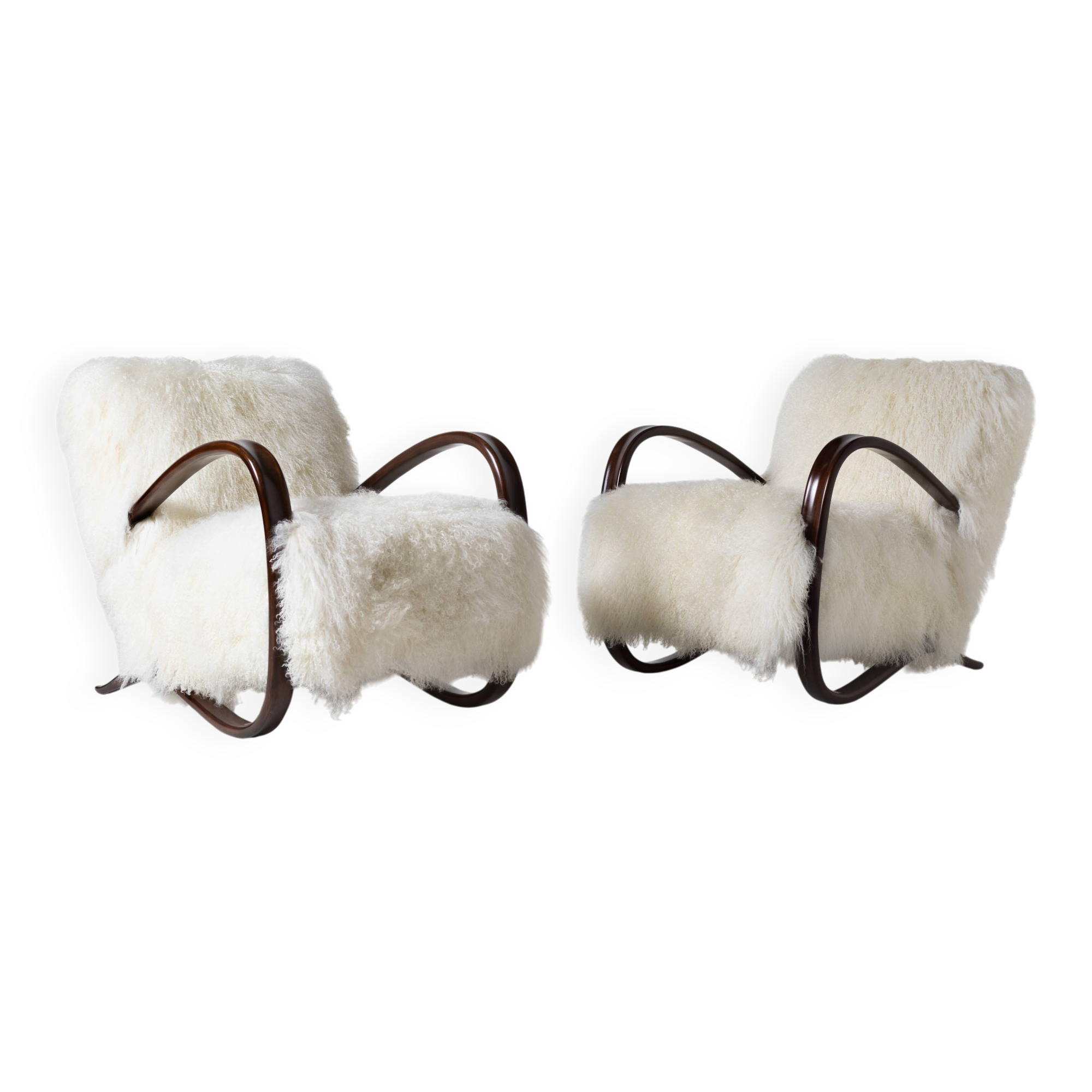 Pair of Jindrich Halabala H 269 lounge chairs in mongolian sheepskin