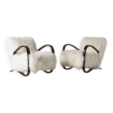 Pair of Jindrich Halabala H 269 lounge chairs in mongolian sheepskin