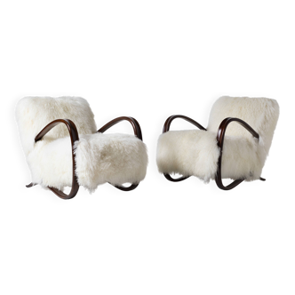 Pair of Jindrich Halabala H 269 lounge chairs in mongolian sheepskin