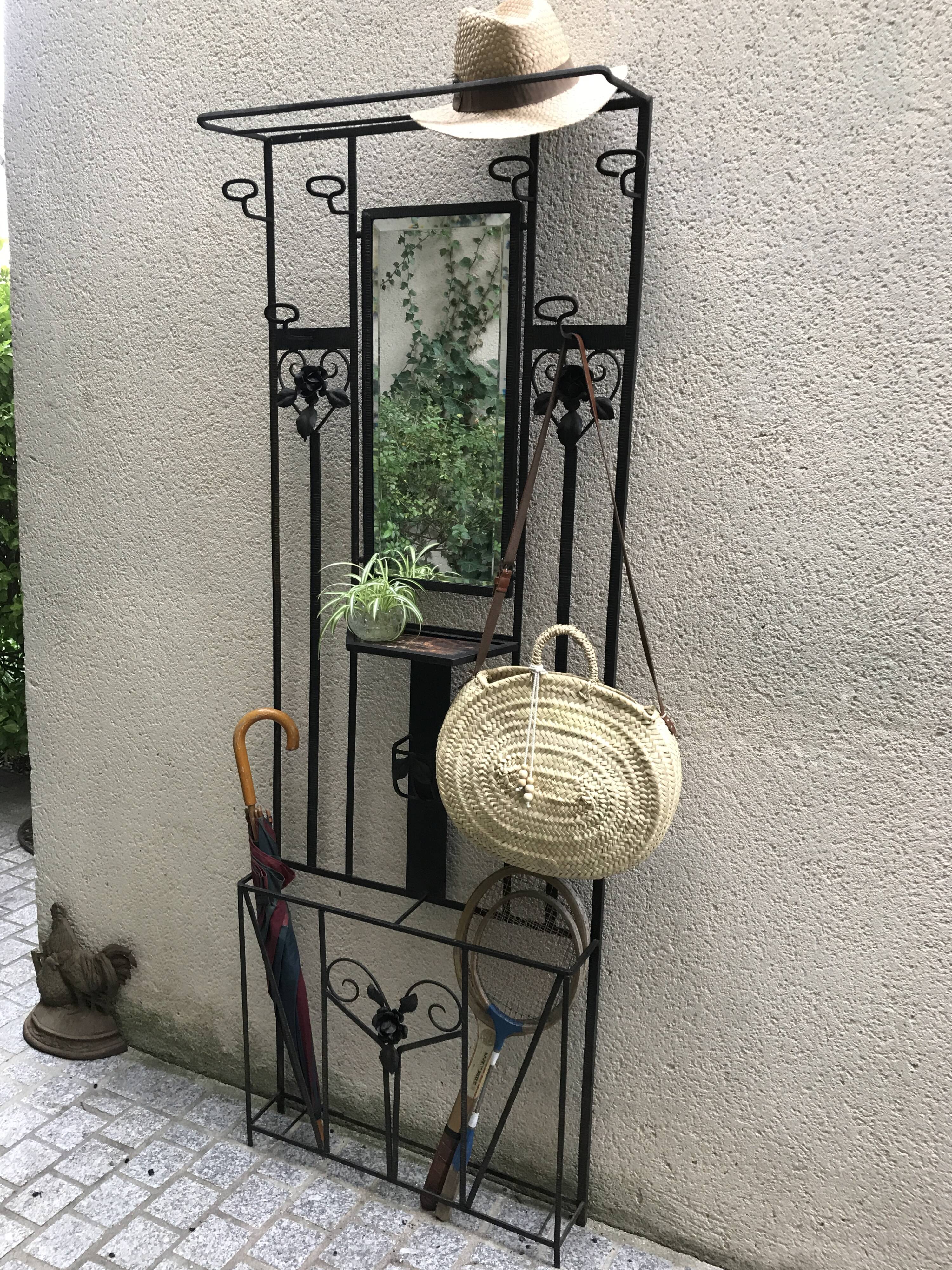 Wrought iron coat holder with 1930
