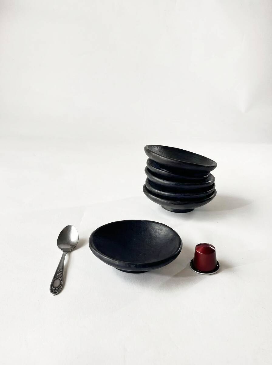 Two smoked terracotta bowls—for mezze, spices, or Kanah sauces.