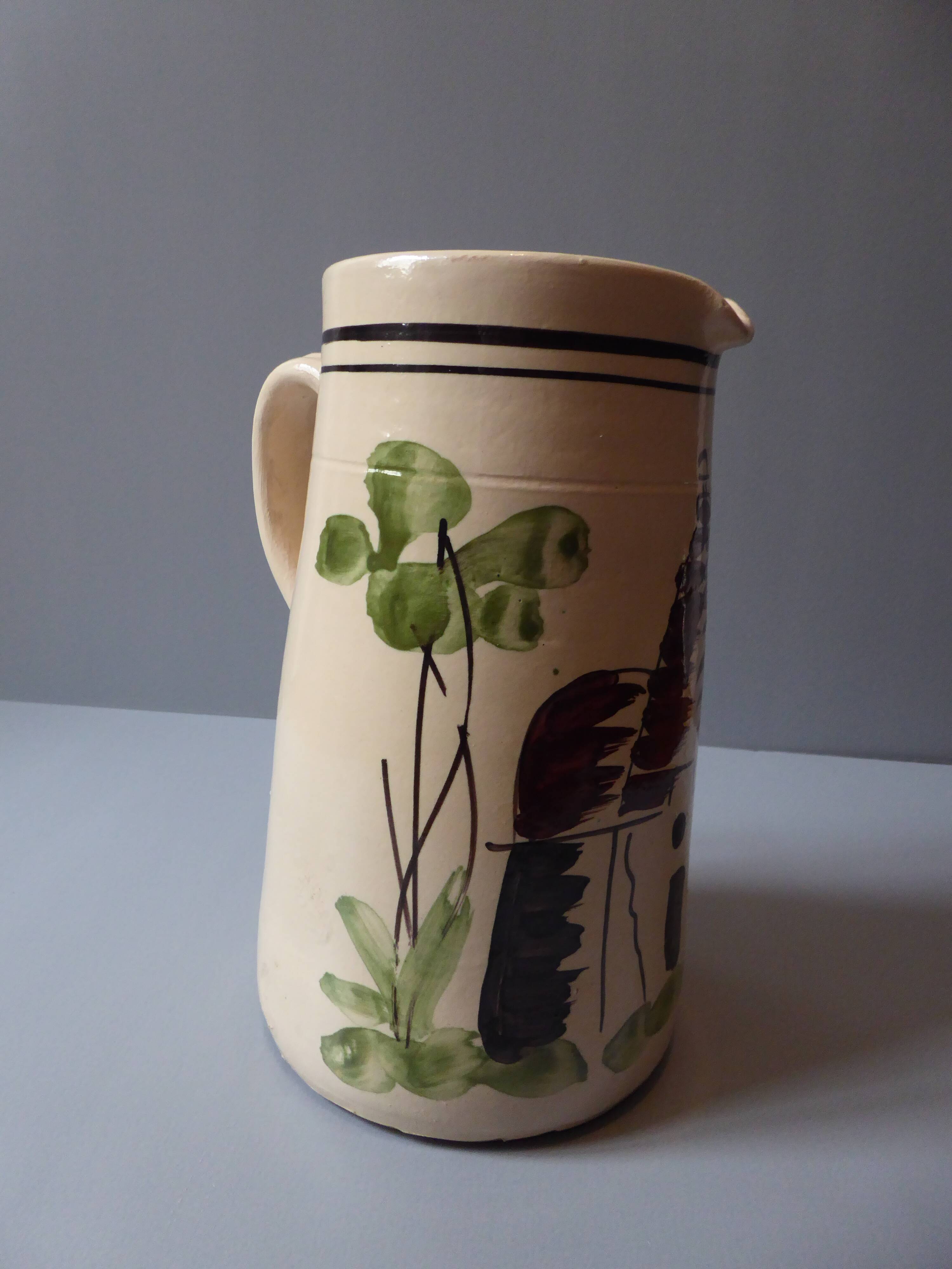 A pitcher in earthenware with a country décor