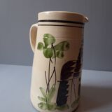 A pitcher in earthenware with a country décor