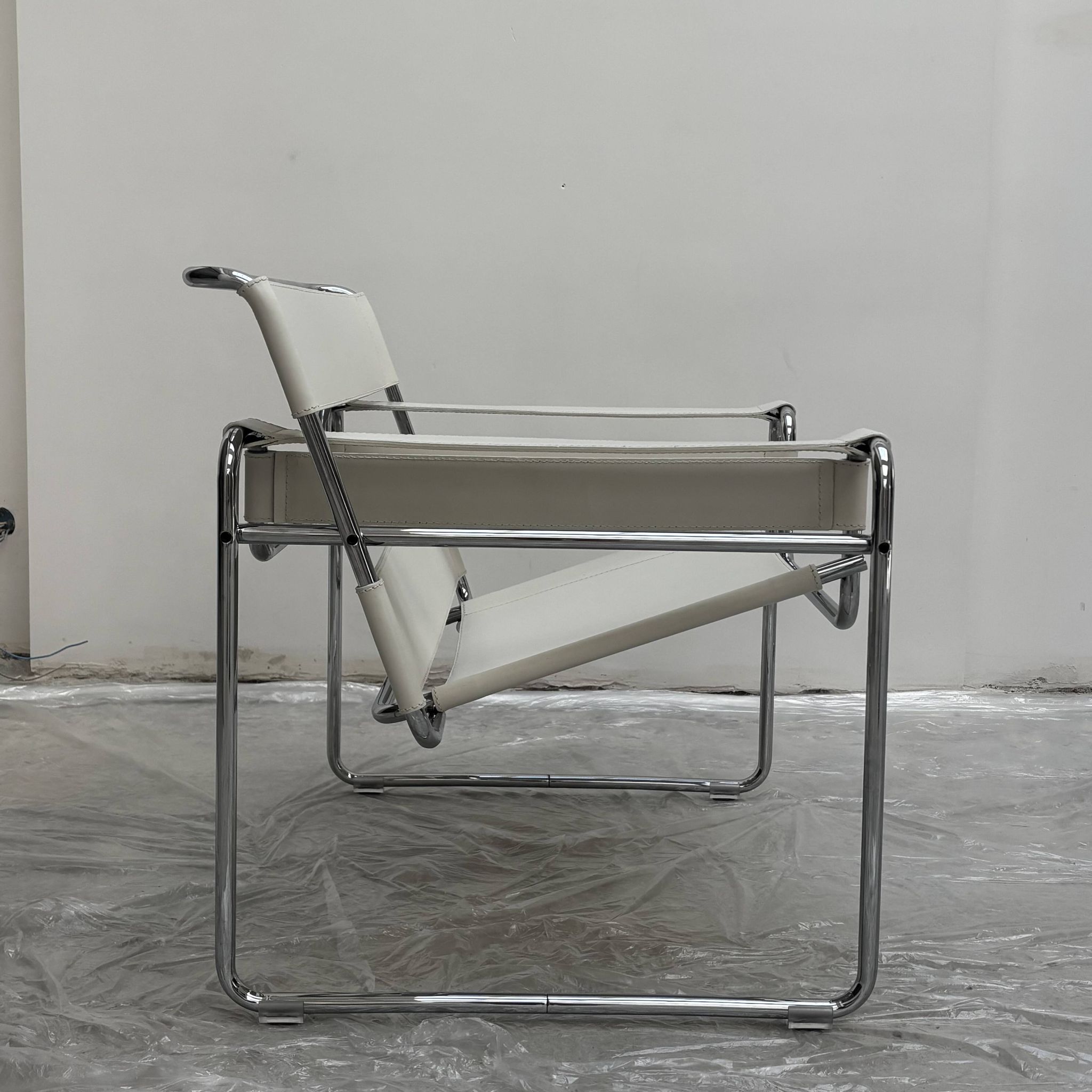 "Wassily" armchair by Marcel Breuer for Gavina in white leather.
