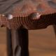 Set of two vintage round tripod stools, wooden farm stools.