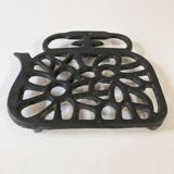 Old enameled cast iron trivet