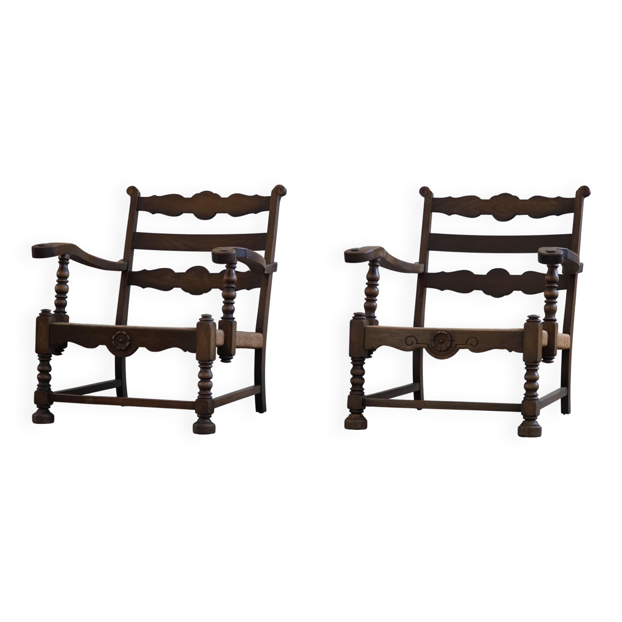 A pair of modern and sculptural vintage Danish armchairs in oak and papercord, 1940s.