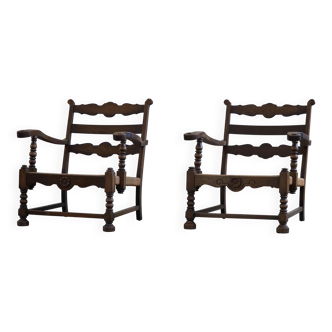 A pair of modern and sculptural vintage Danish armchairs in oak and papercord, 1940s.