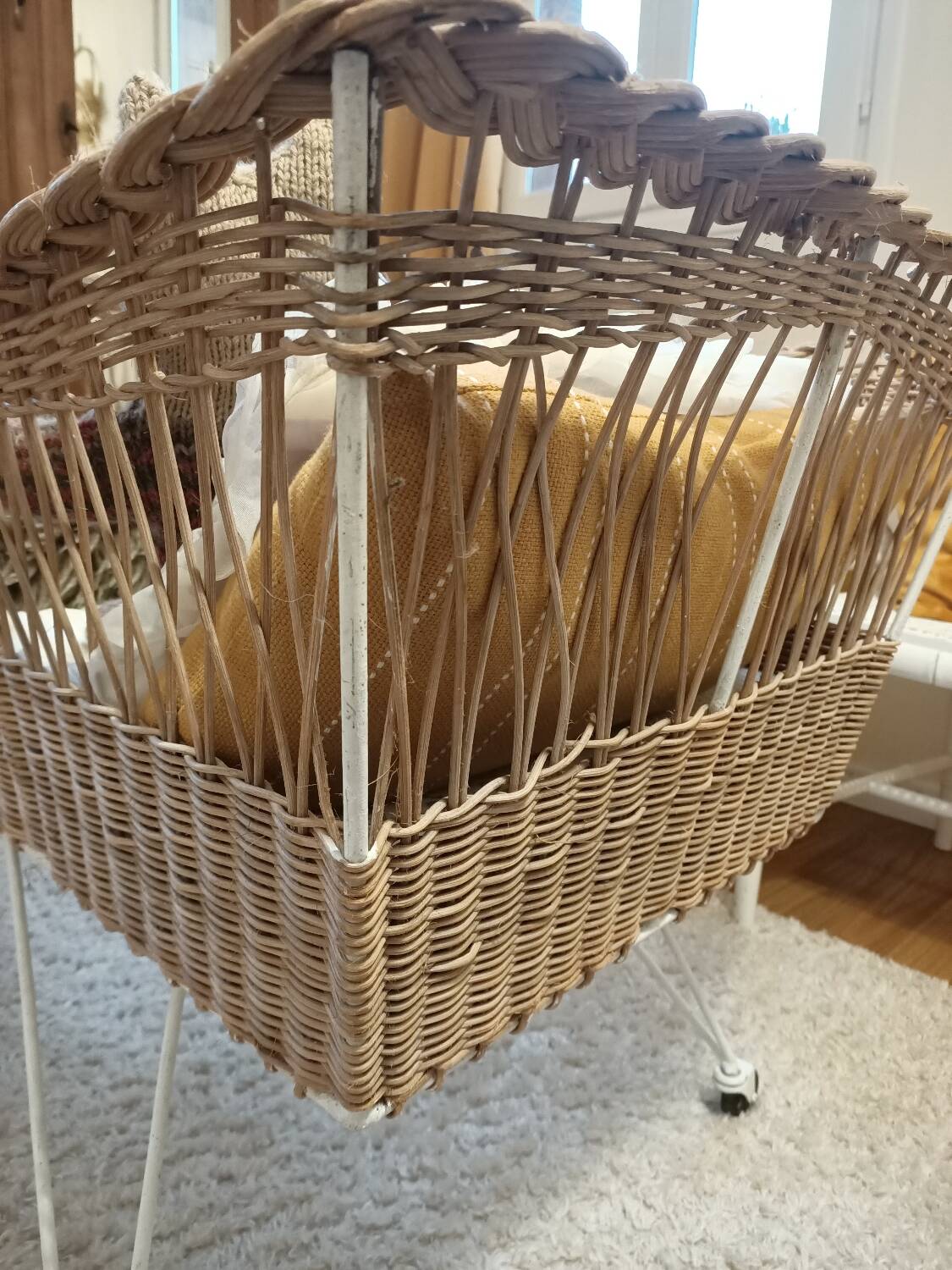 Rattan and wrought iron cradle