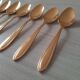 Small golden metal spoons