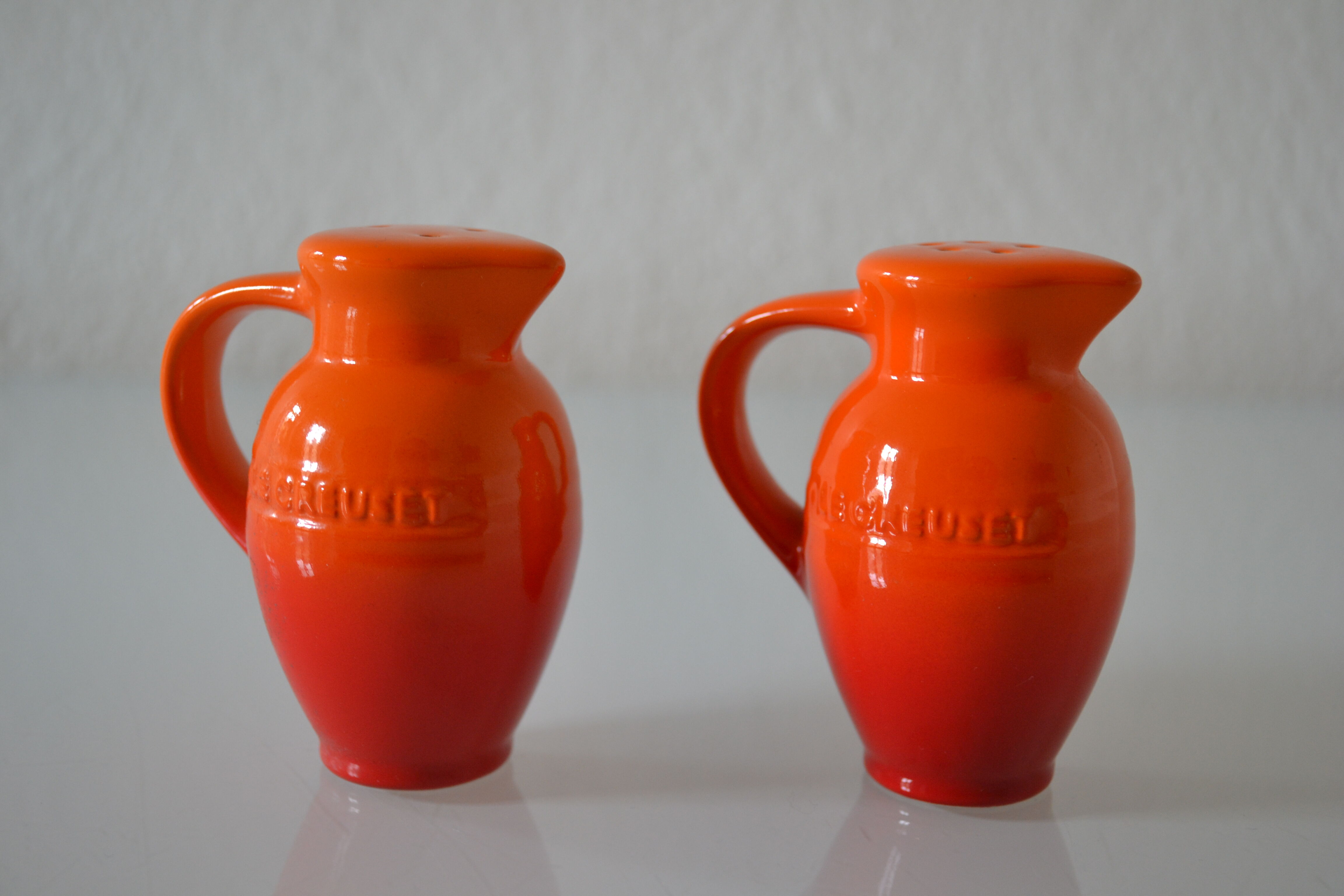 Le Creuset orange advertising salt and pepper