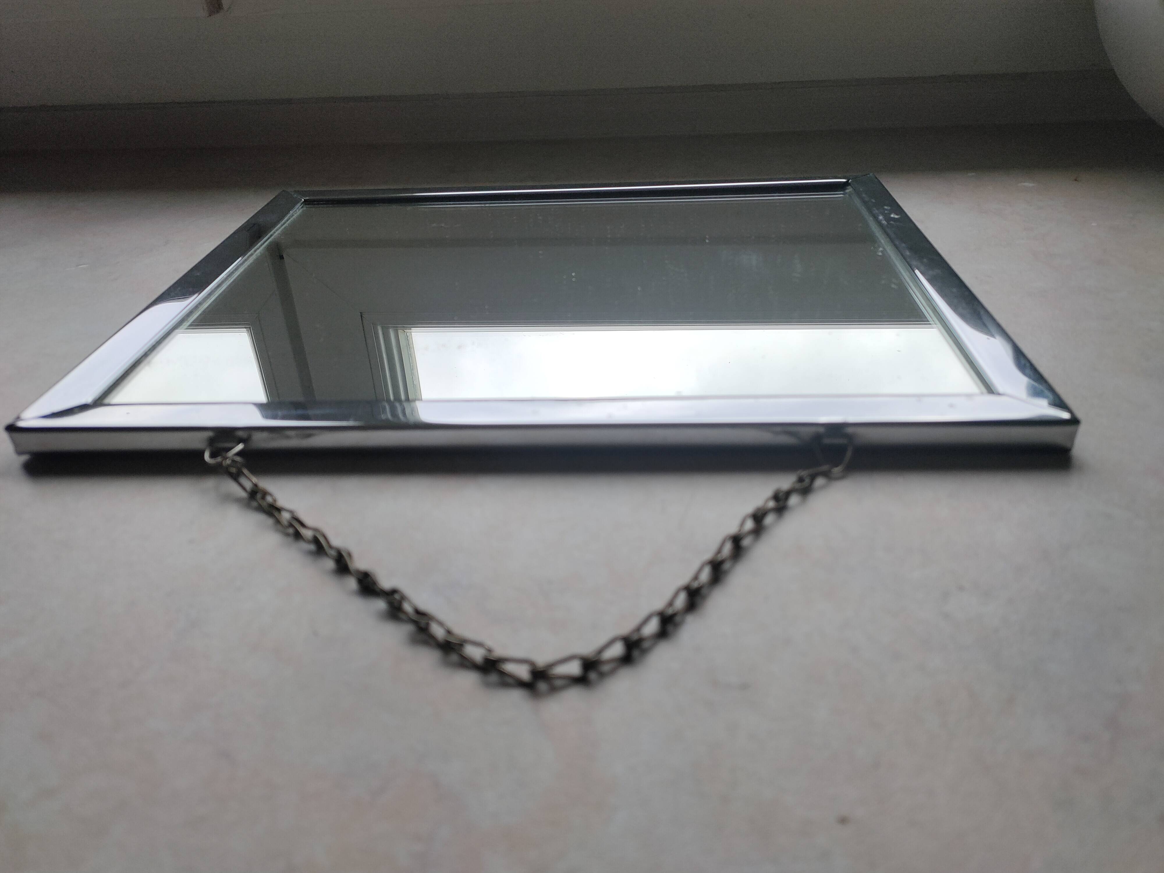 Barber mirror with chain.