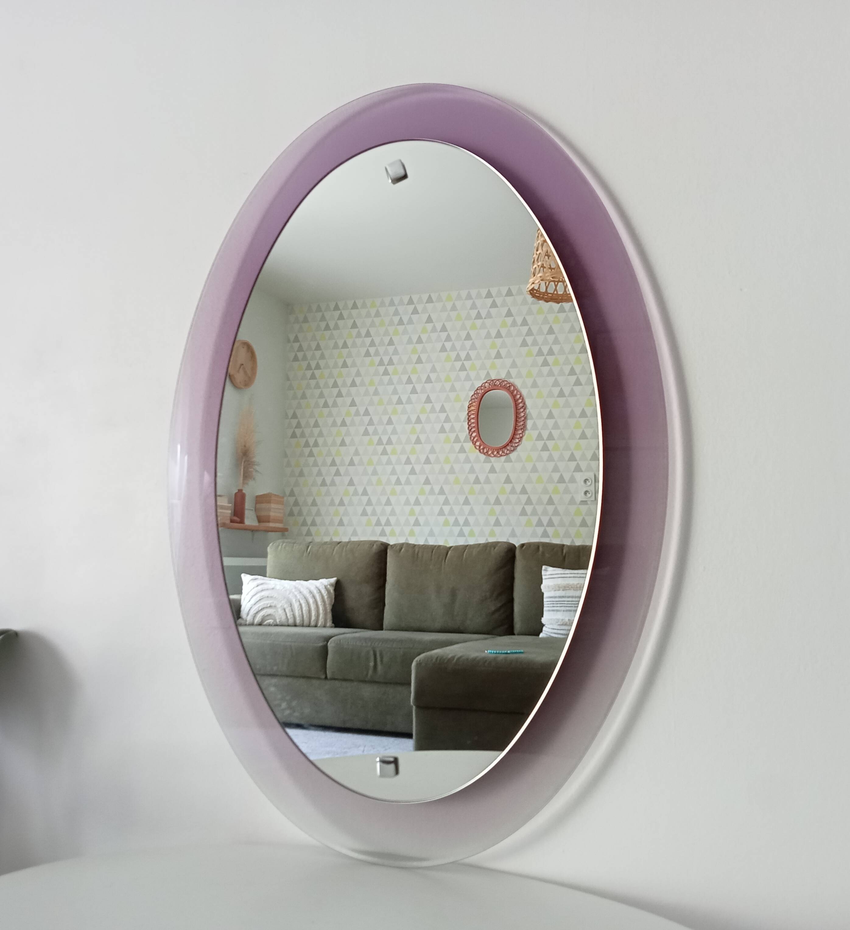Vintage oval plexiglass mirror from the 70s by Harvey Guzzini
