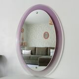 Vintage oval plexiglass mirror from the 70s by Harvey Guzzini