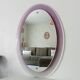 Vintage oval plexiglass mirror from the 70s by Harvey Guzzini