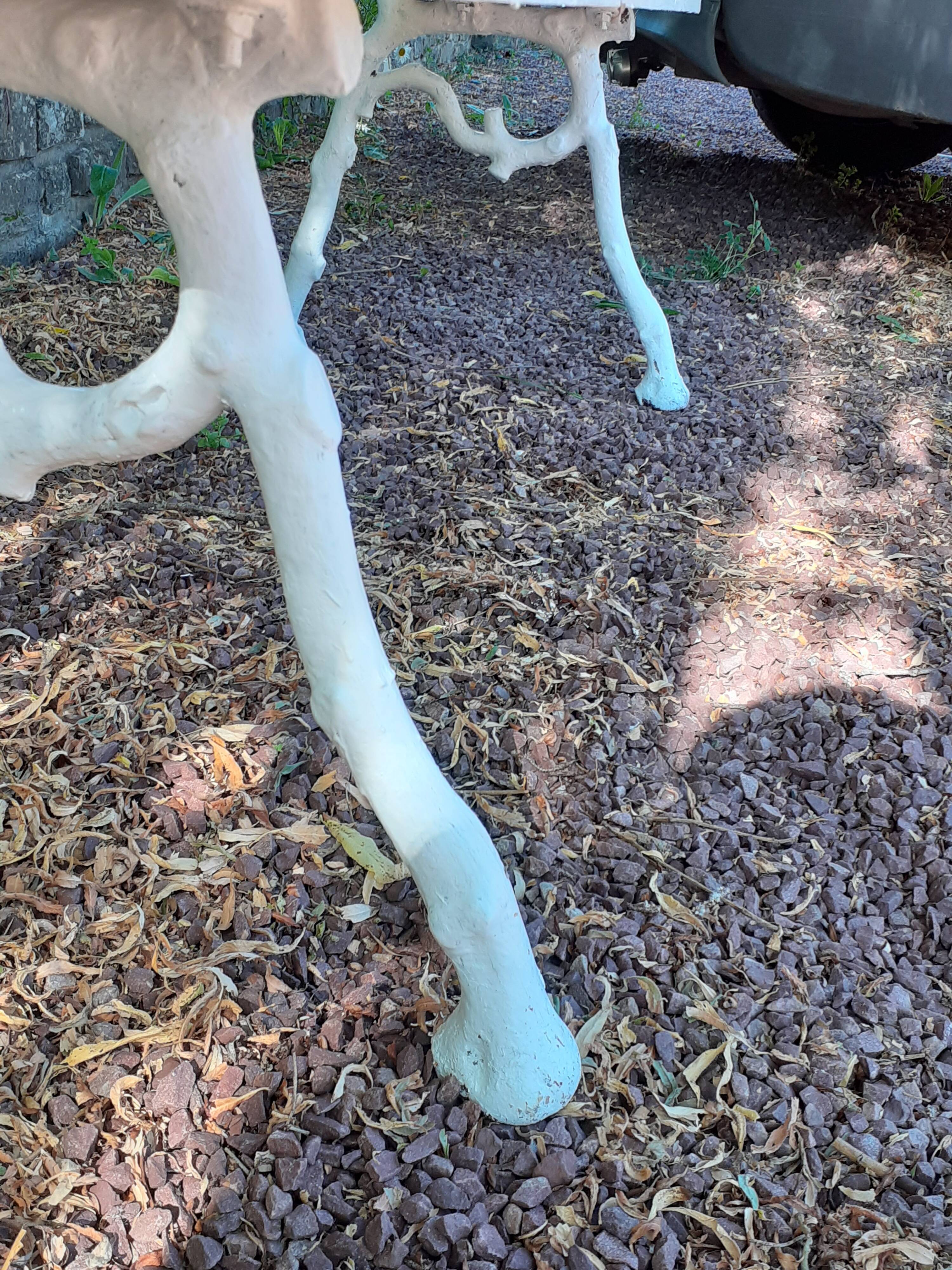 Old garden bench with cast iron feet and wooden planks