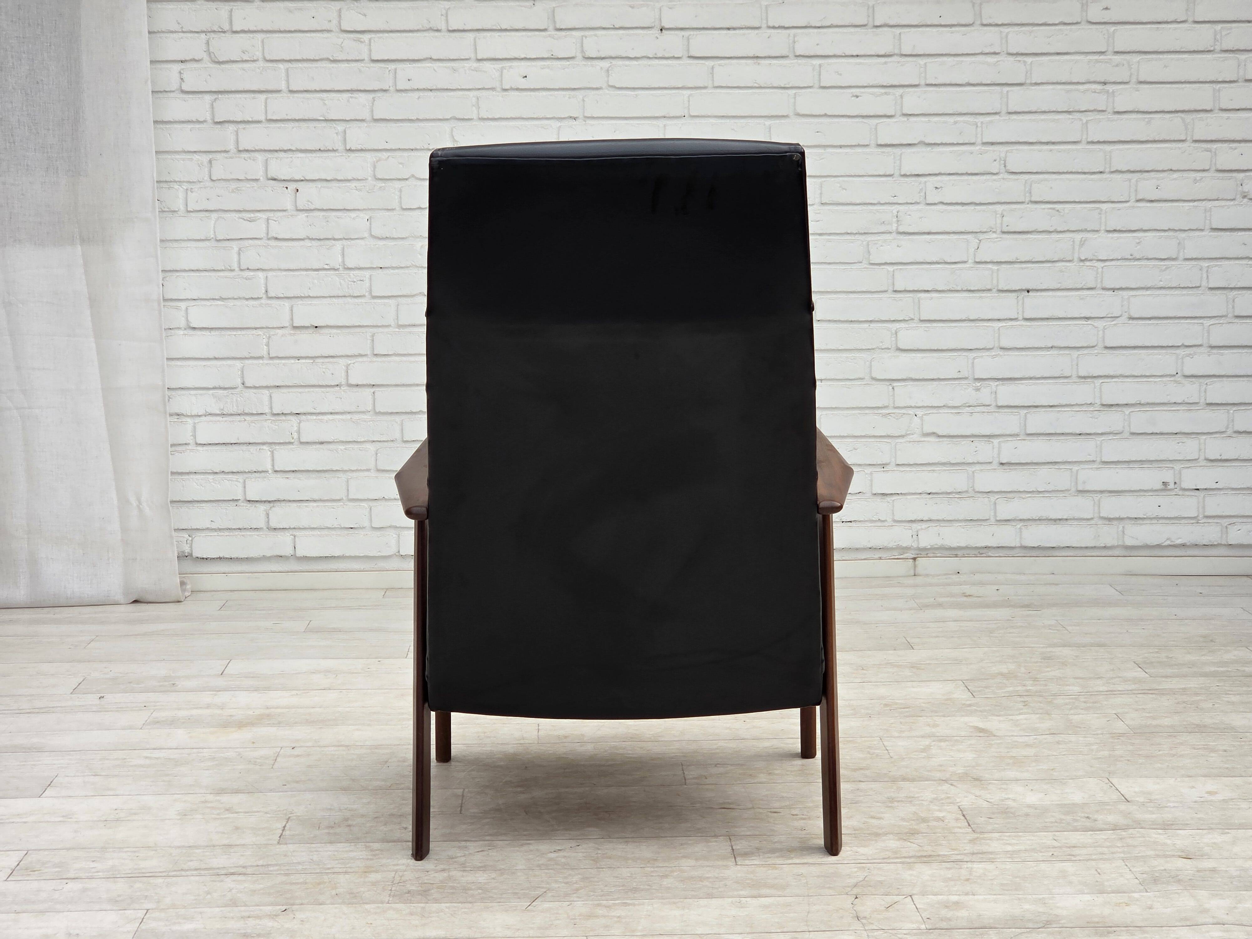 1970s, Danish armchair, black artificial leather, teak wood.